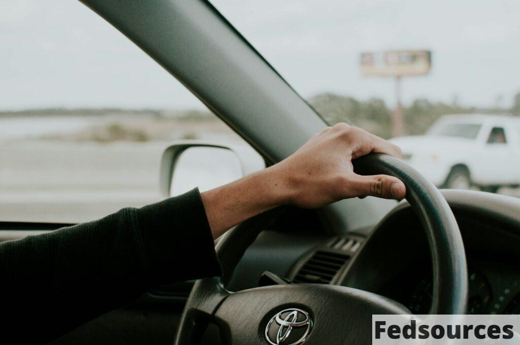 person driving Toyota car